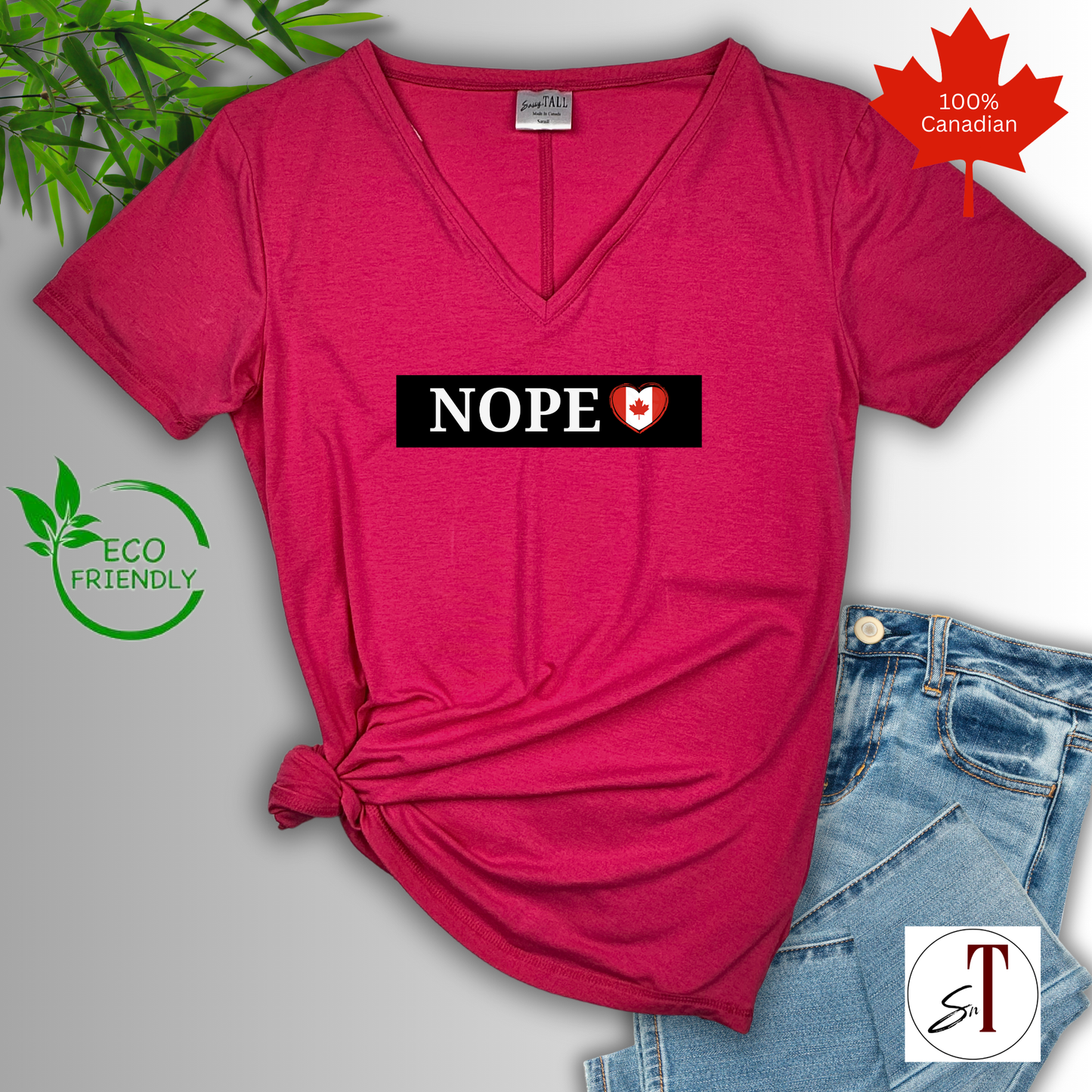 Model pointing to bold “Nope. Canada Isn’t for Sale.” design, clean typography, Canadian-made protest shirt with attitude.
